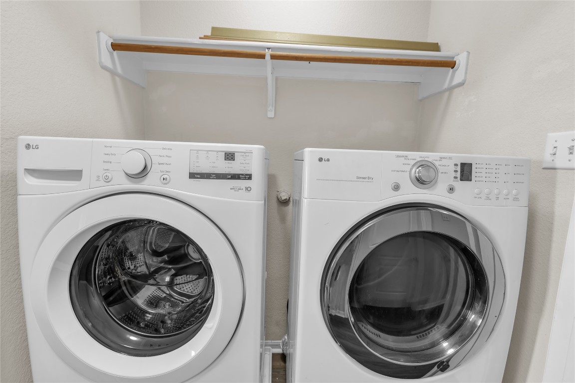 3733 Eagles Nest Street Round Rock, TX 78665 - Photo 17 of 19 a utility room with dryer and washer