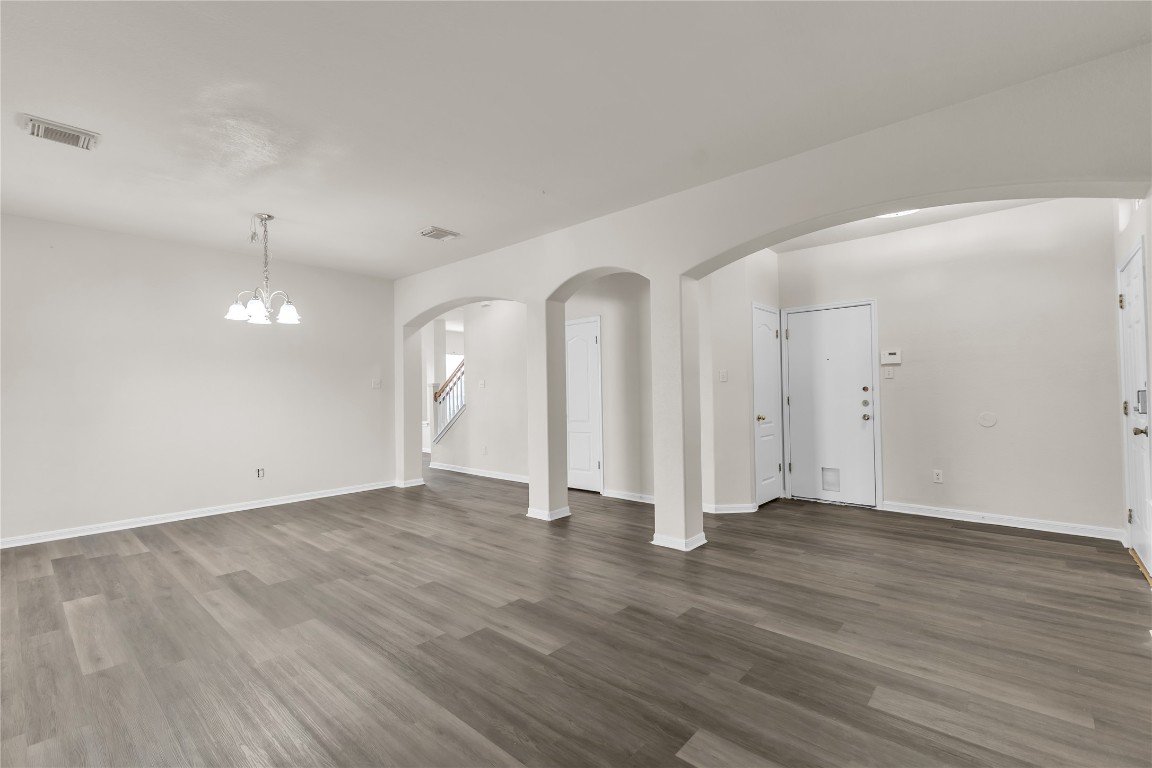 3733 Eagles Nest Street Round Rock, TX 78665 - Photo 3 of 19 an empty room with wooden floor and windows