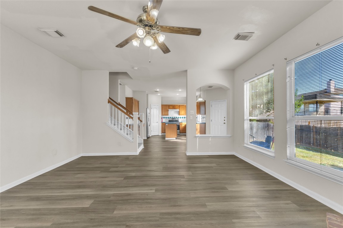 3733 Eagles Nest Street Round Rock, TX 78665 - Photo 9 of 19 a view of an empty room with wooden floor and a window