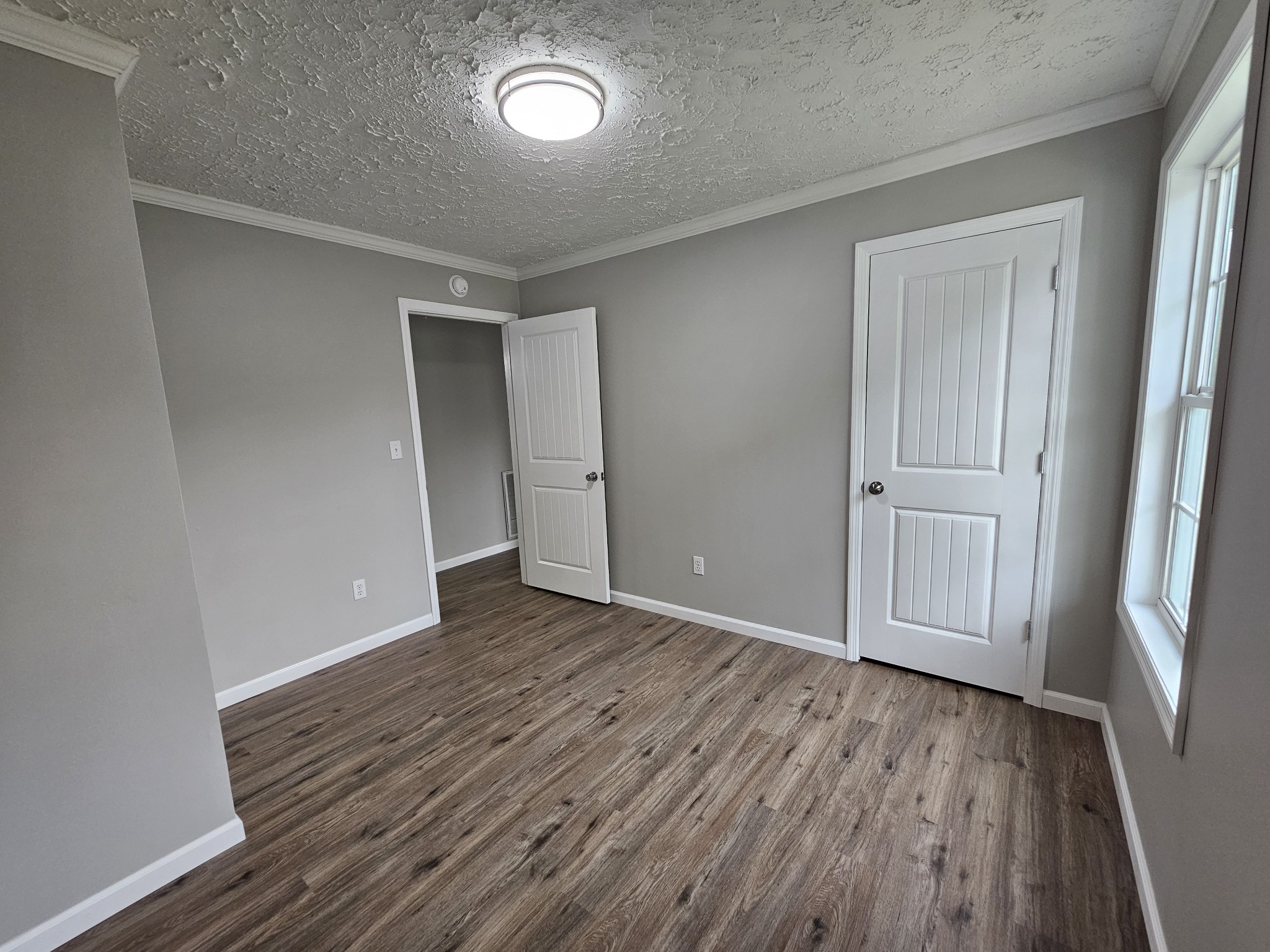 362 Forest Point Road Monteagle, TN 37356 - Photo 37 of 42 an empty room with wooden floor and closet