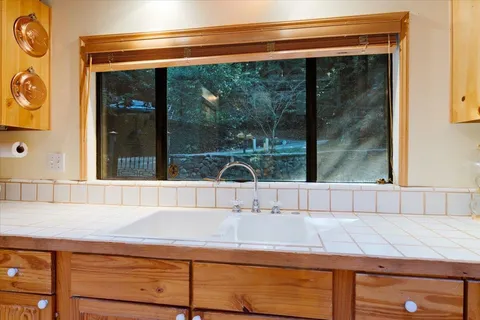 a living room with furniture a rug and a window