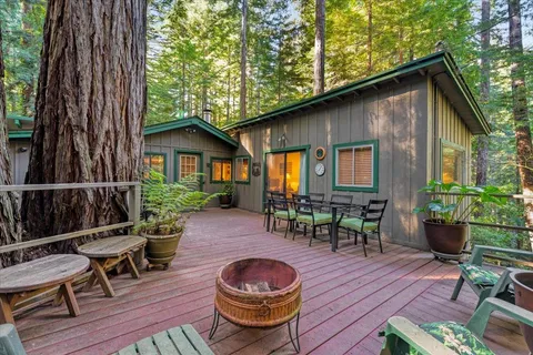 a backyard of a house with wooden floor yard and outdoor seating