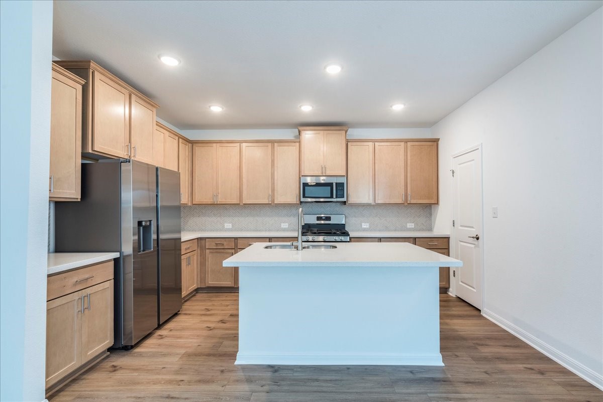 108 Makinaw Road Hutto, TX 78634 - Photo 7 of 34 Large walk in pantry on the right with under stairs storage!