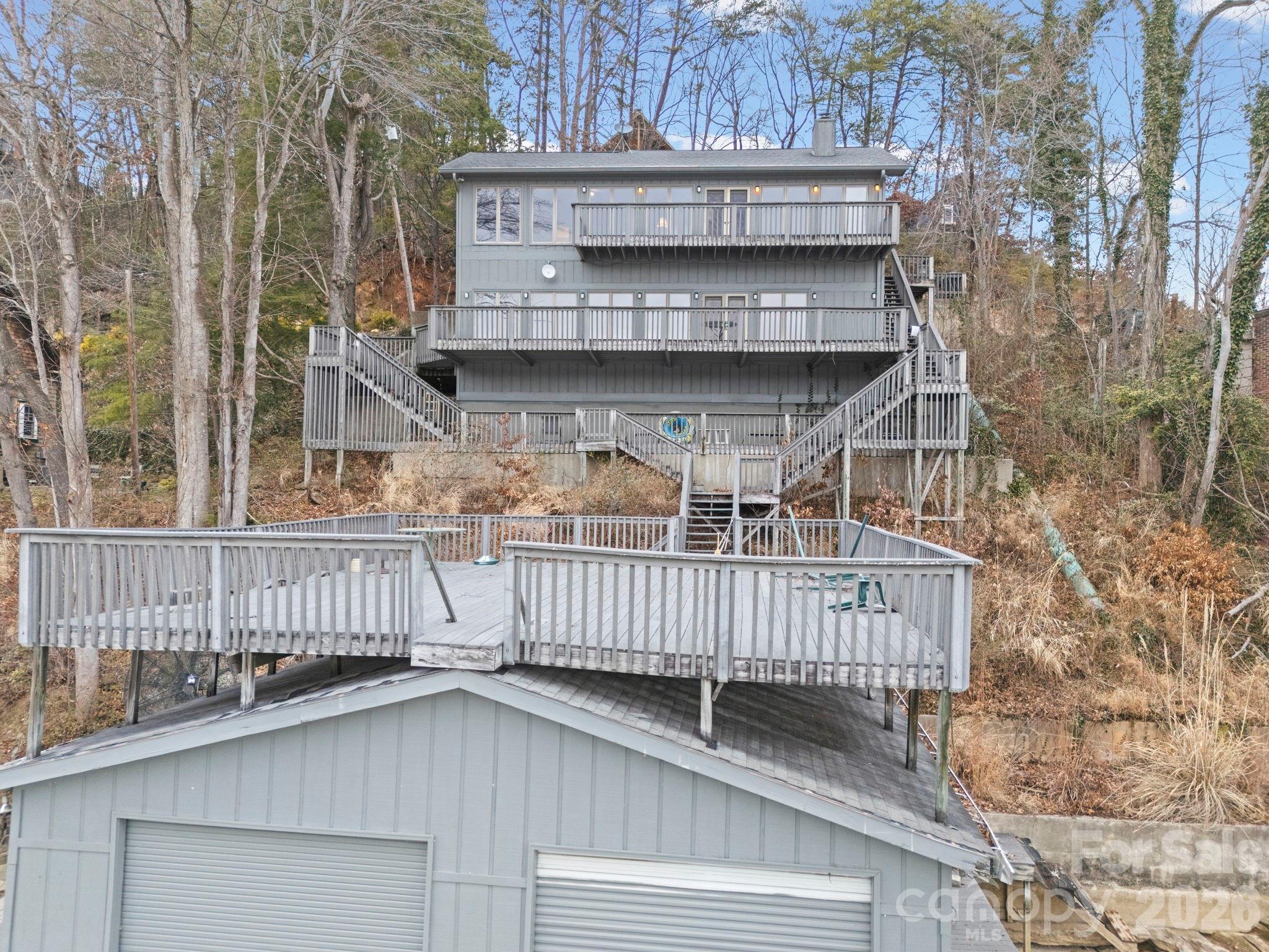 336 Burnt Ridge Road Lake Lure, NC 28746 - Photo 12 of 45 a view of a wooden house with a deck