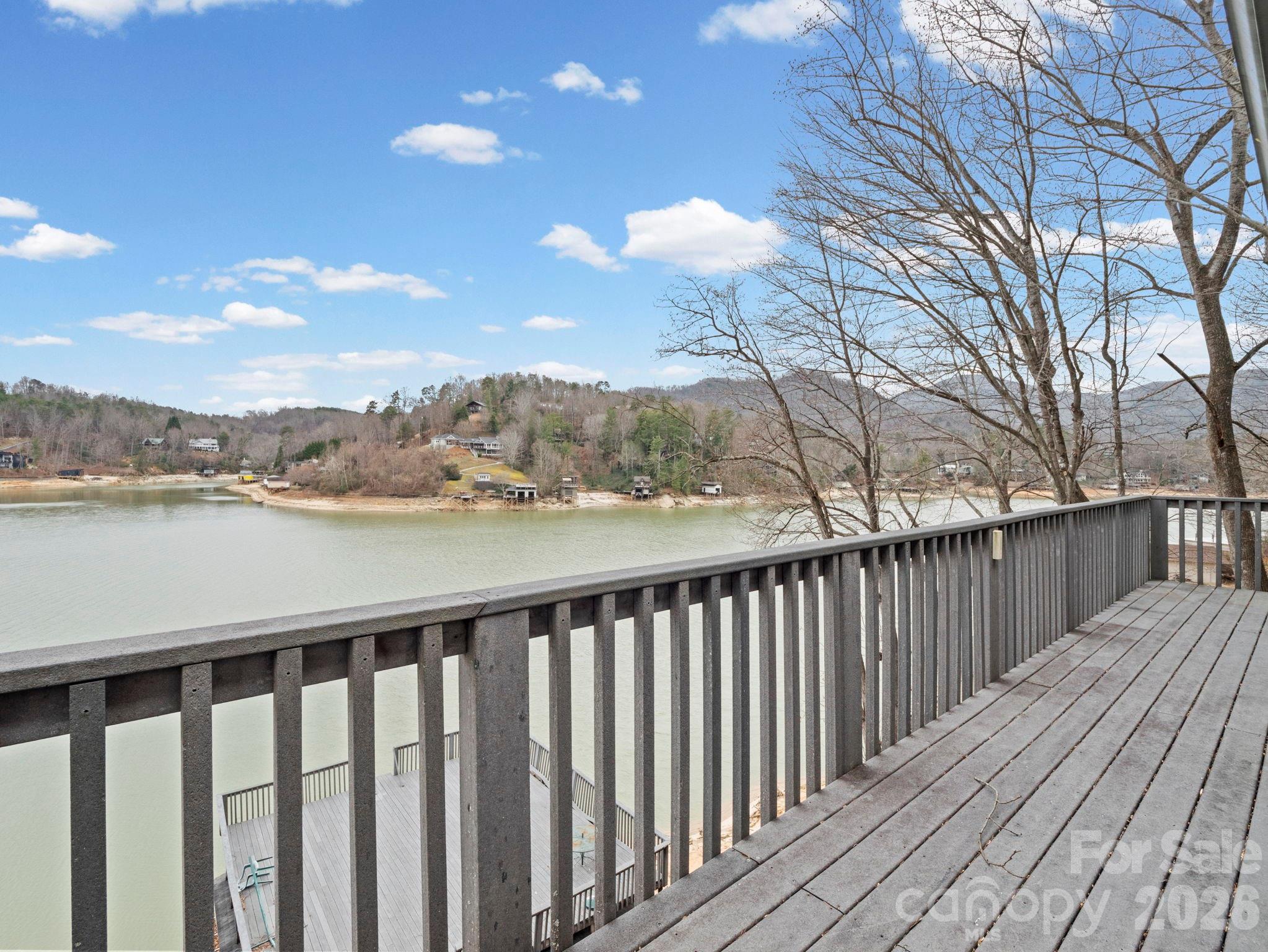 336 Burnt Ridge Road Lake Lure, NC 28746 - Photo 28 of 45 a balcony with wooden floor and city view