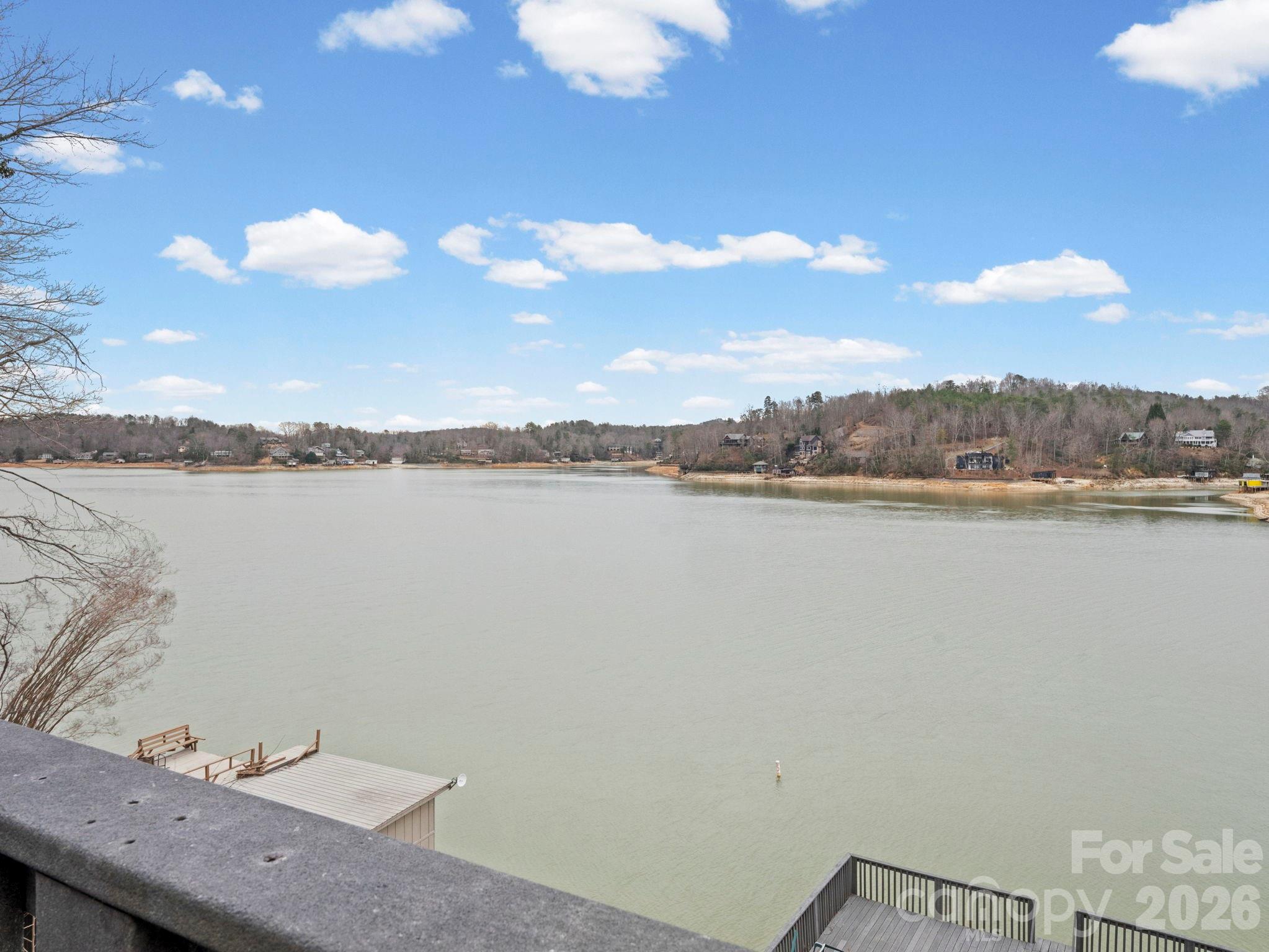 336 Burnt Ridge Road Lake Lure, NC 28746 - Photo 30 of 45 a view of a lake with sunset