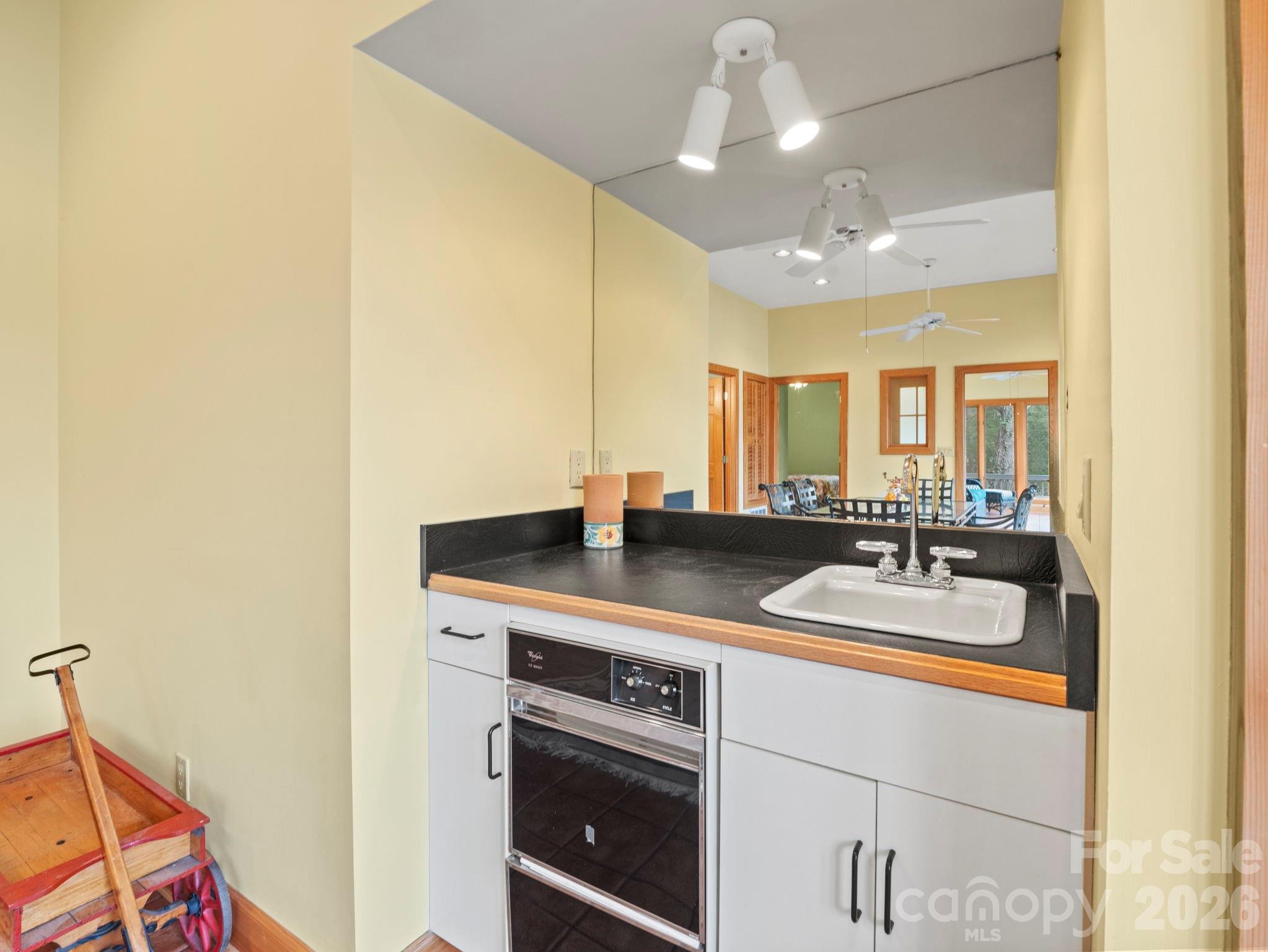 336 Burnt Ridge Road Lake Lure, NC 28746 - Photo 32 of 45 a bathroom with a sink and a mirror
