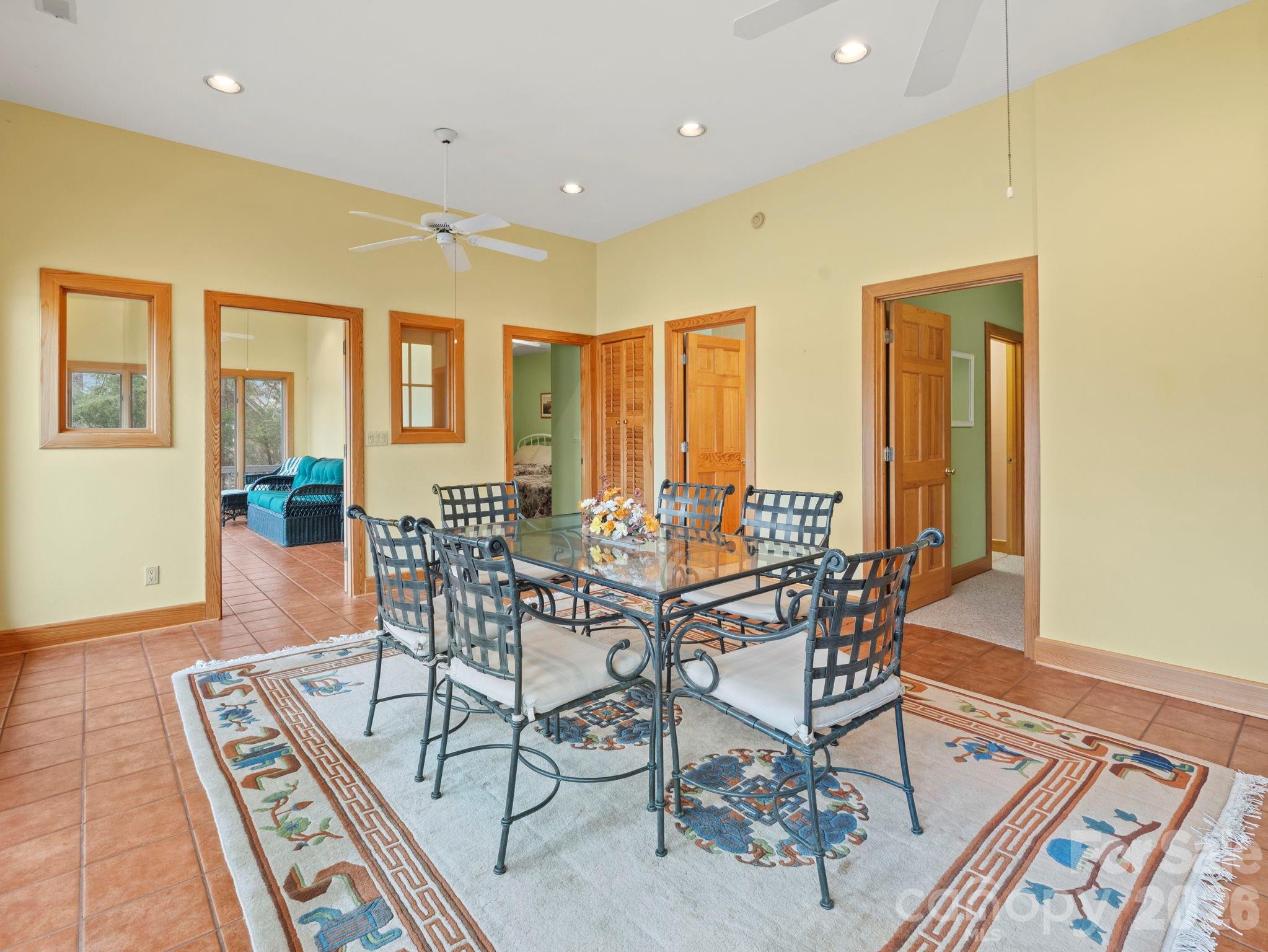 336 Burnt Ridge Road Lake Lure, NC 28746 - Photo 33 of 45 a view of a dining room with furniture and wooden floor