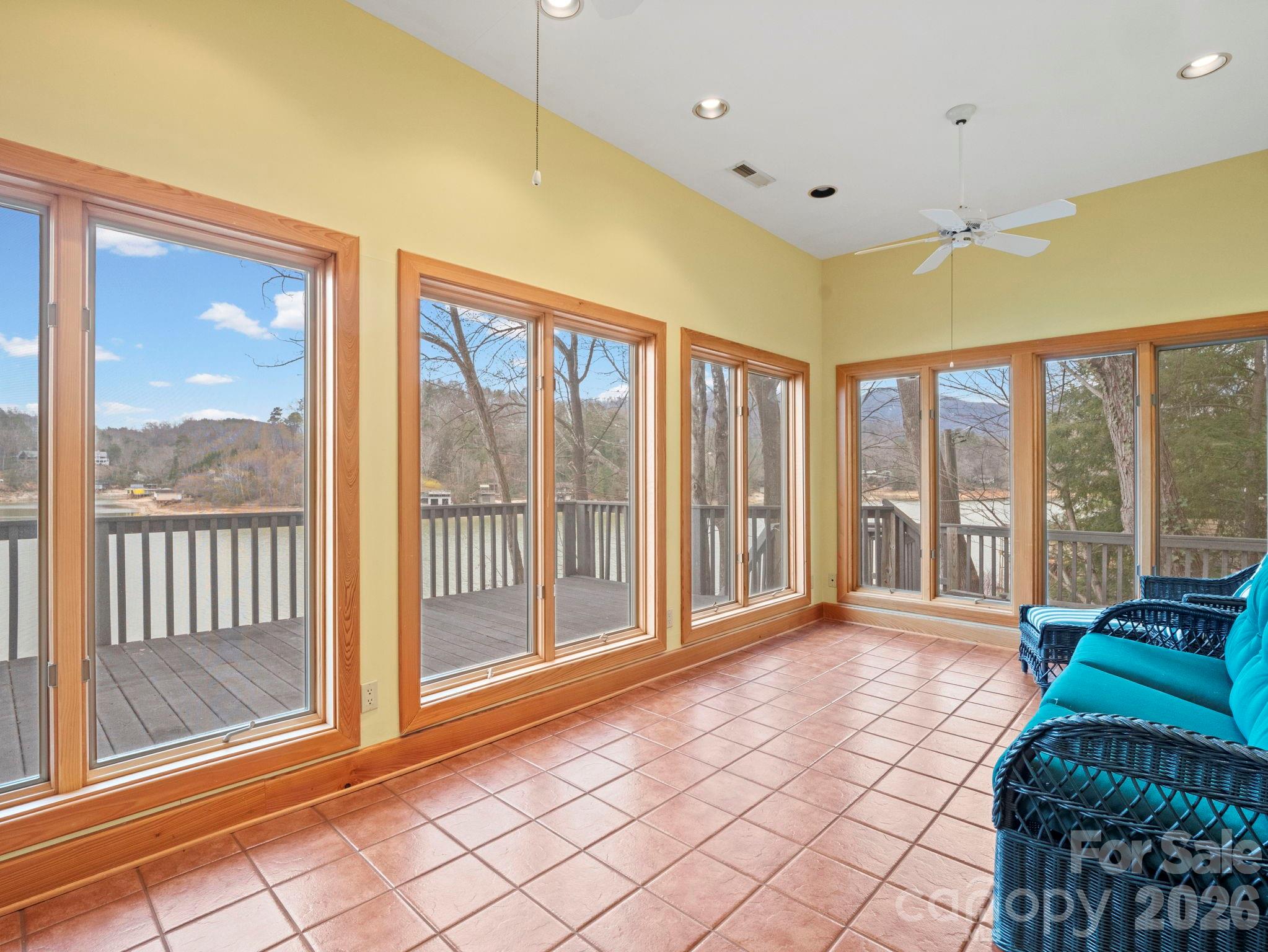 336 Burnt Ridge Road Lake Lure, NC 28746 - Photo 34 of 45 a spacious bedroom with a large window and a balcony