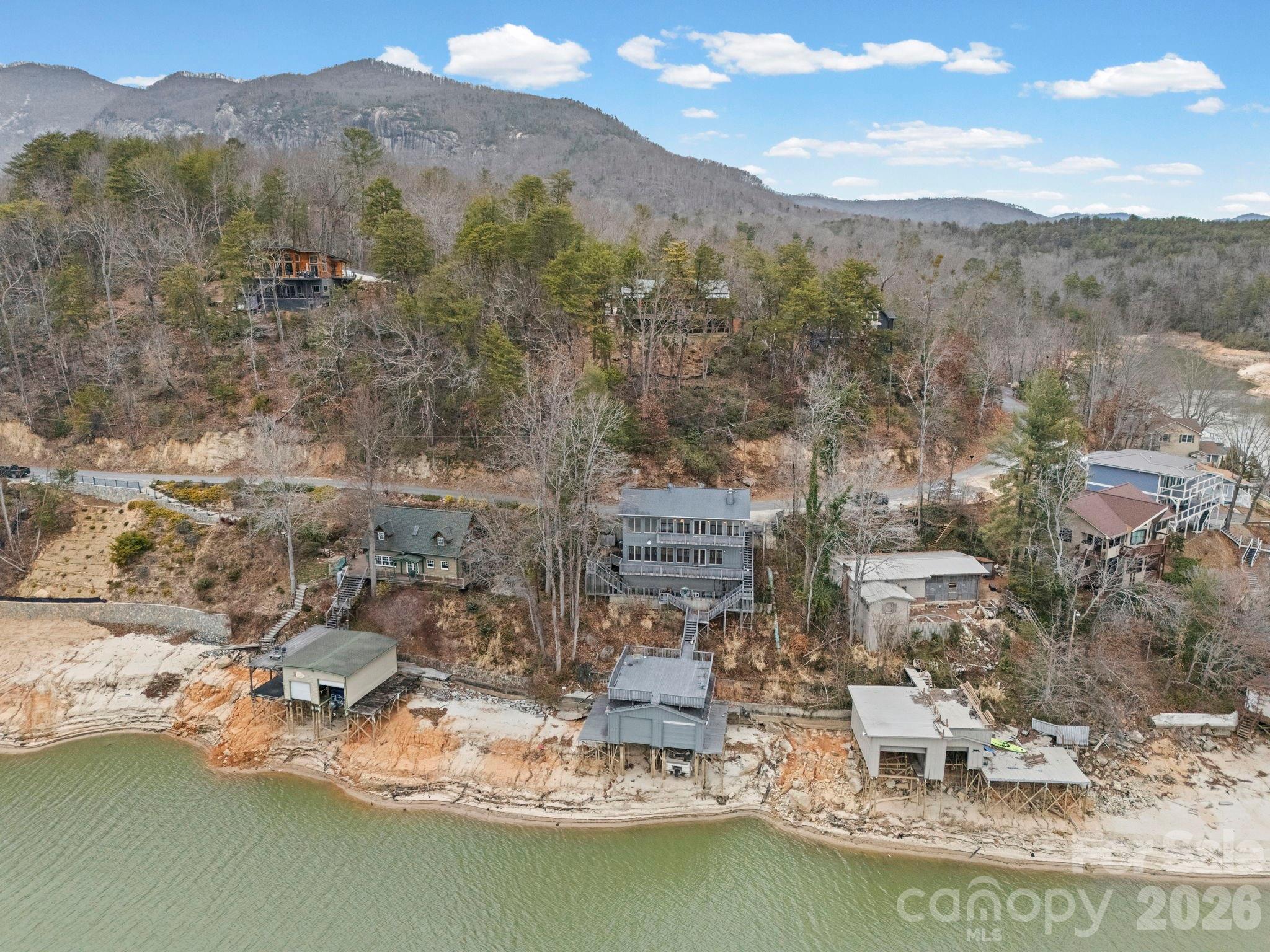 336 Burnt Ridge Road Lake Lure, NC 28746 - Photo 6 of 45 a view of a lake with a mountain in the background