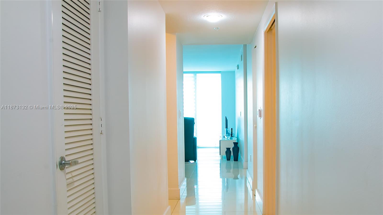 18100 North Bay Road, Unit 905 Sunny Isles Beach, FL 33160 - Photo 13 of 25 a view of a bathroom from a hallway
