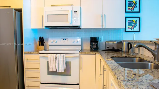 a kitchen with a stove and a microwave