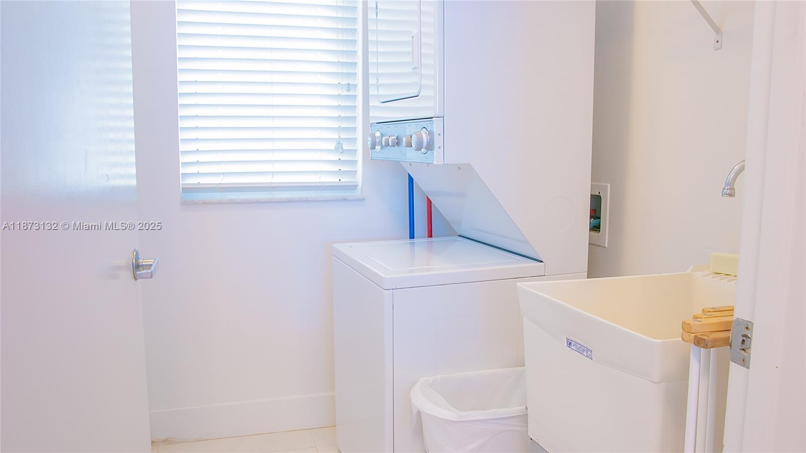 18100 North Bay Road, Unit 905 Sunny Isles Beach, FL 33160 - Photo 17 of 25 a bathroom with a sink and a toilet