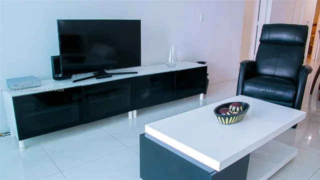 a view of a bedroom with a bed