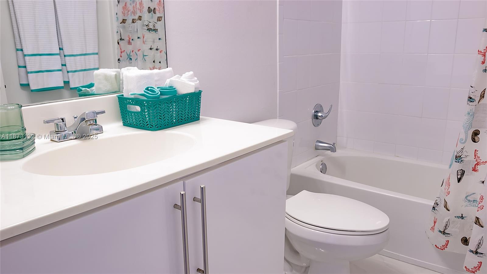 18100 North Bay Road, Unit 905 Sunny Isles Beach, FL 33160 - Photo 5 of 25 a bathroom with a sink a toilet and bathtub