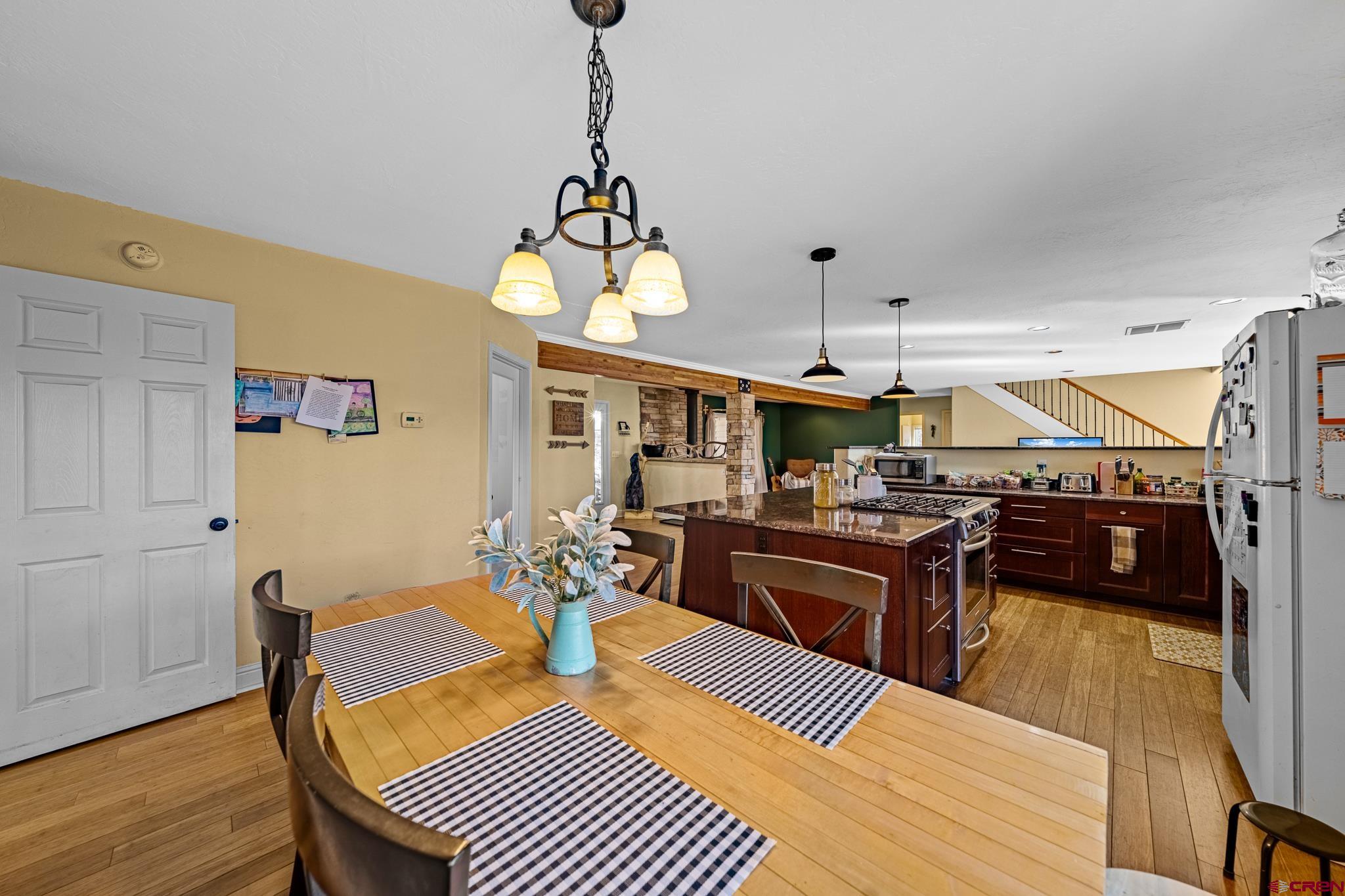 700 Blue Ridge Drive Bayfield, CO 81122 - Photo 12 of 30 a view of a dining room with furniture window and wooden floor