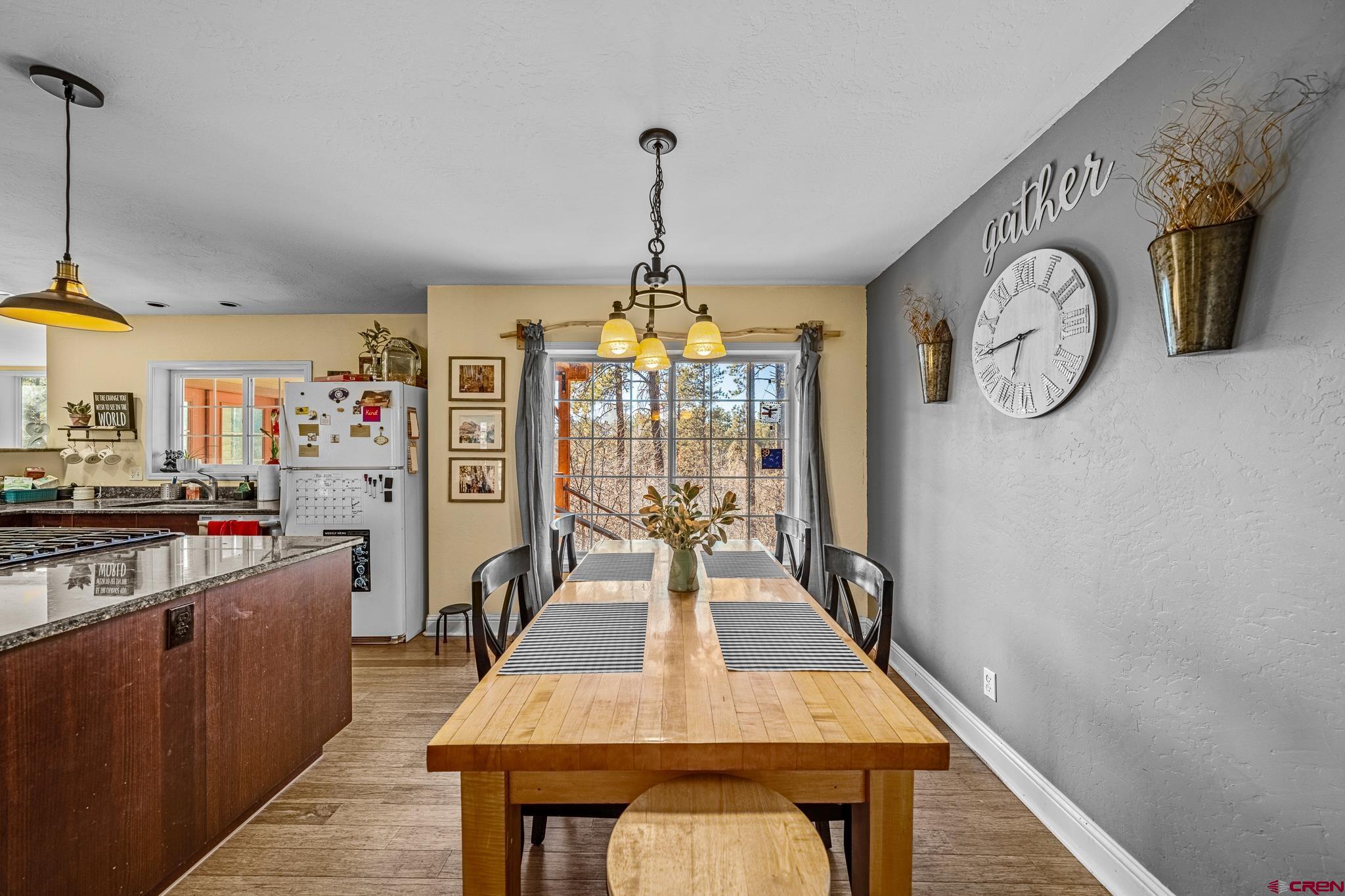 700 Blue Ridge Drive Bayfield, CO 81122 - Photo 13 of 30 a view of a dining room with furniture window and wooden floor