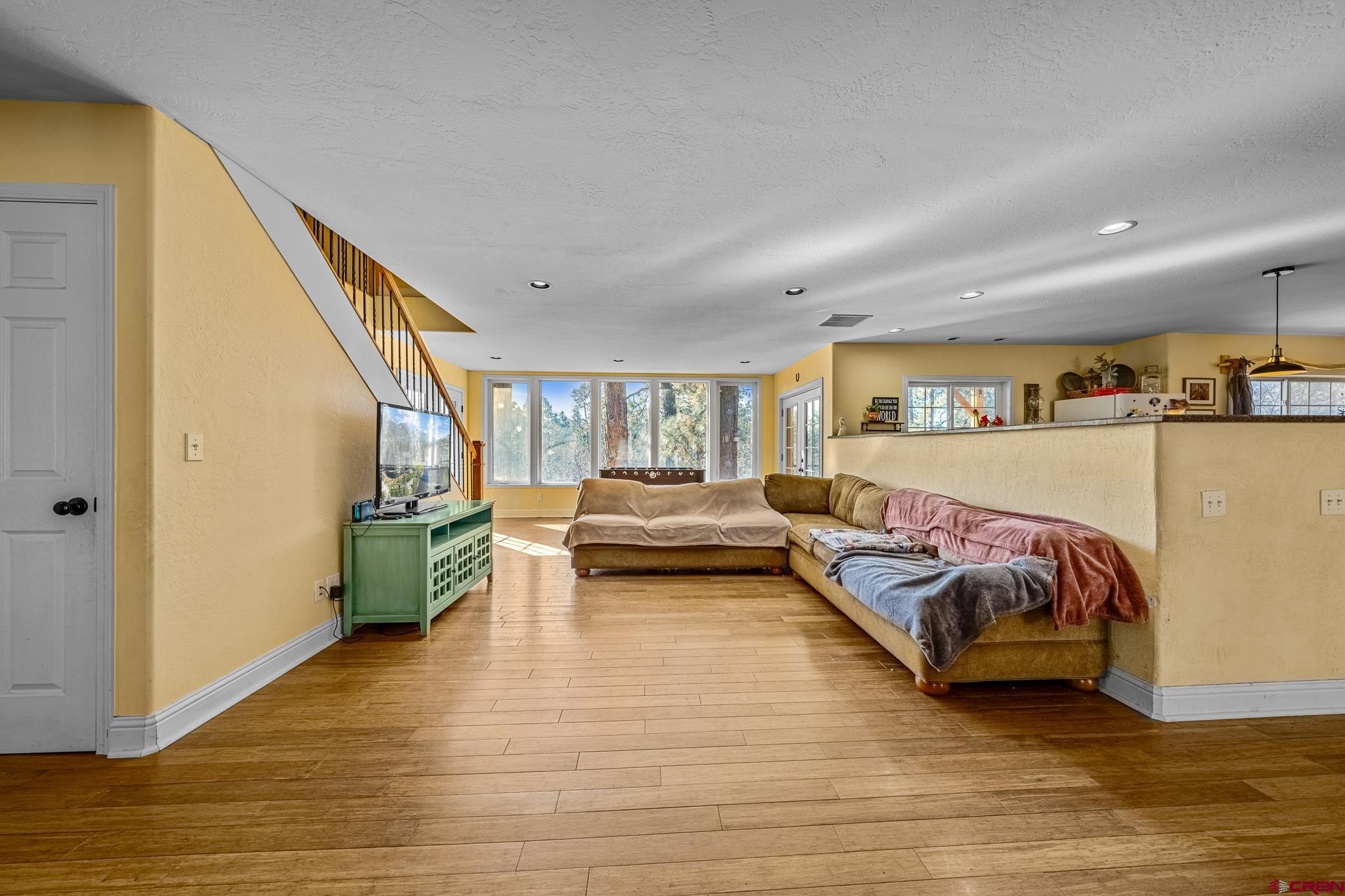 700 Blue Ridge Drive Bayfield, CO 81122 - Photo 15 of 30 a spacious bedroom with a bed and furniture