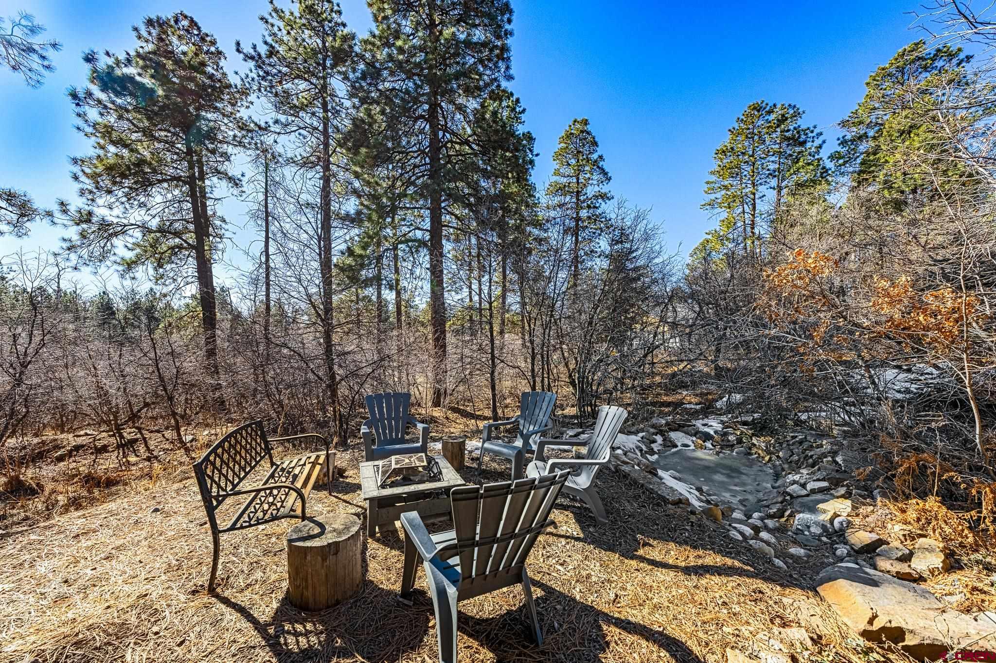 700 Blue Ridge Drive Bayfield, CO 81122 - Photo 27 of 30 a view of a patio with table and chairs and potted plants