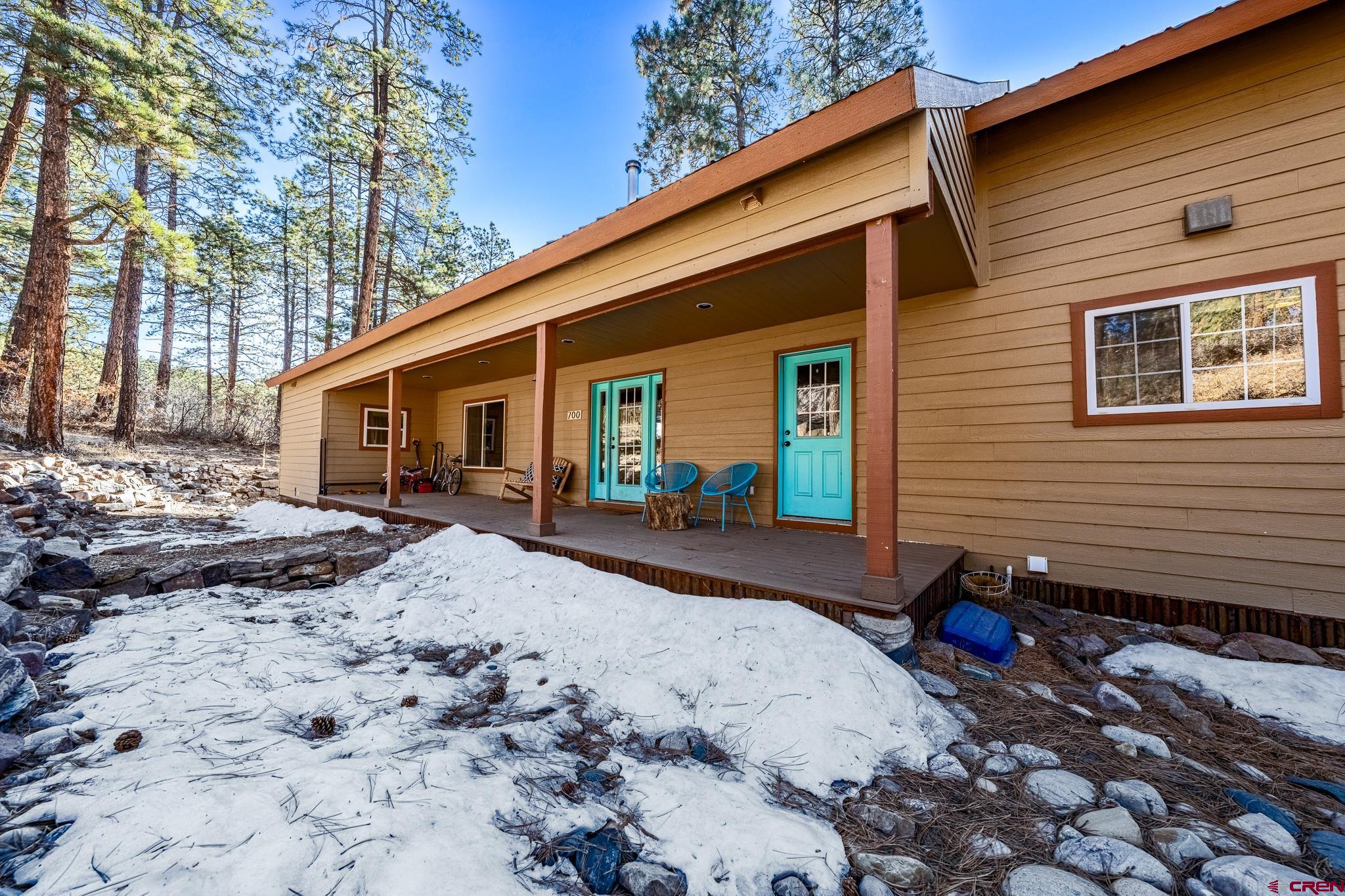 700 Blue Ridge Drive Bayfield, CO 81122 - Photo 3 of 30 a view of a backyard with a sitting area