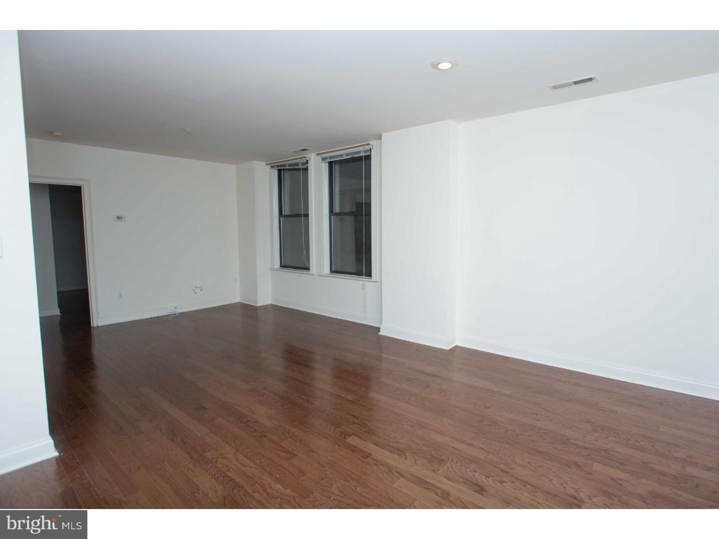 1411-3 Walnut Street, Unit 502 Philadelphia, PA 19102 - Photo 5 of 15 a view of an empty room with wooden floor