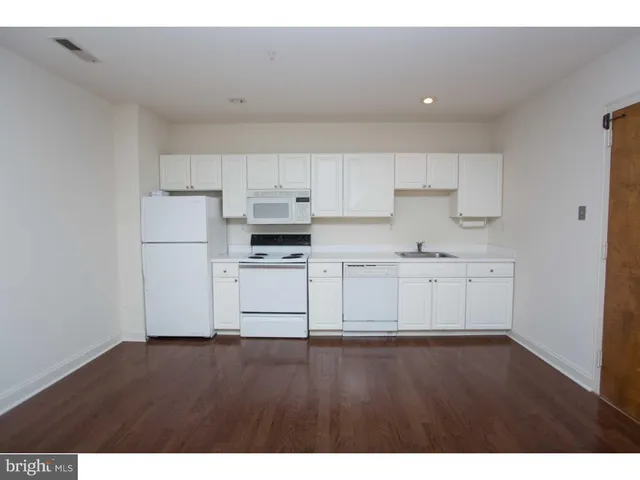 a view of kitchen with wooden floor