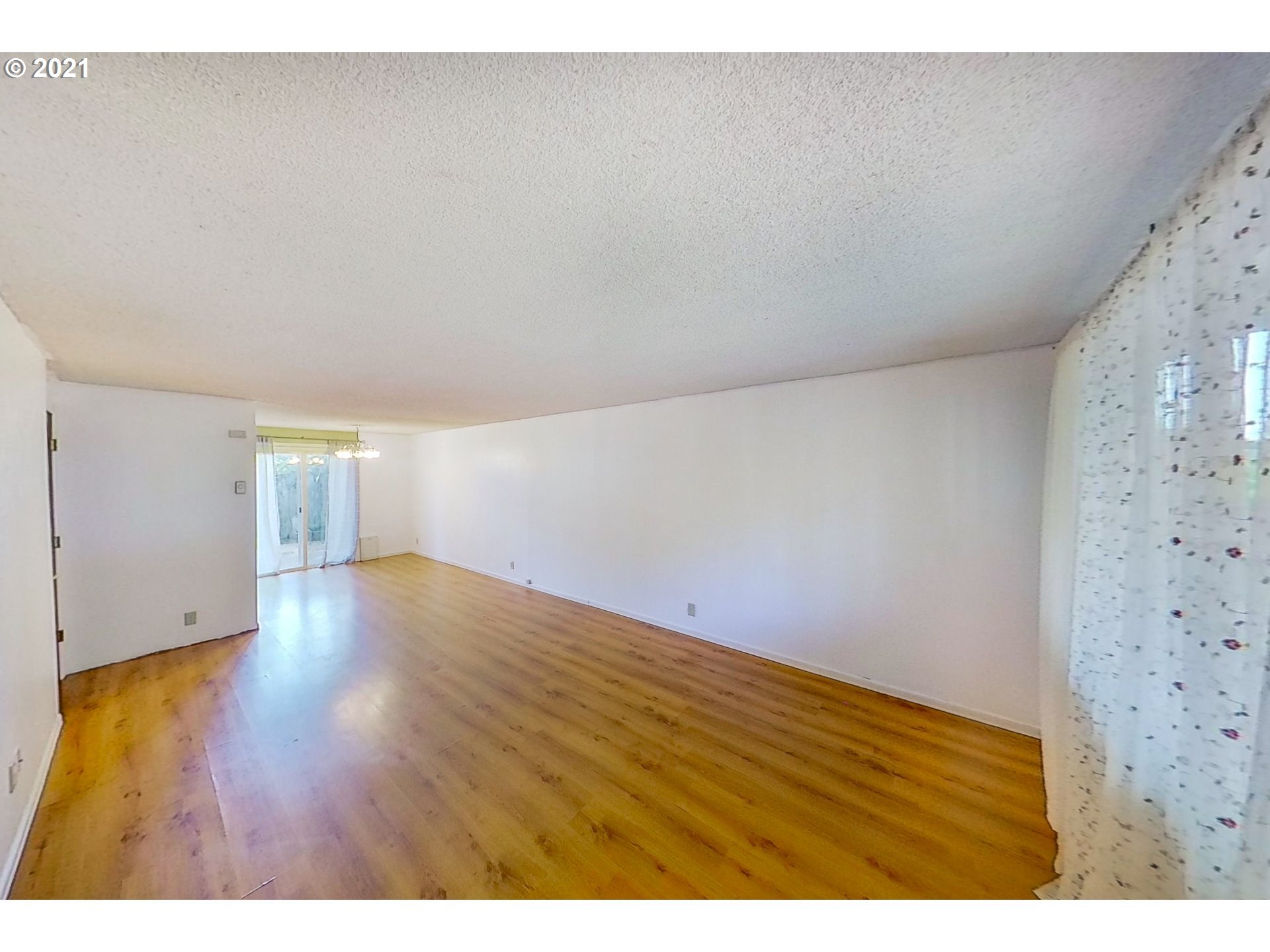 5231 G Street Springfield, OR 97478 - Photo 2 of 17 a view of empty room with wooden floor