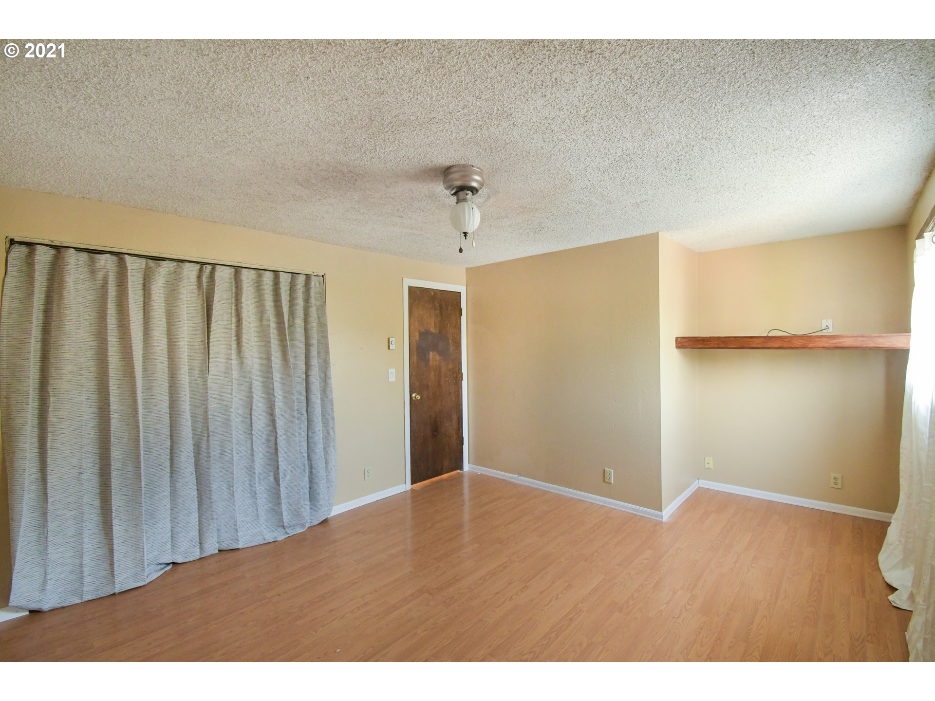 5231 G Street Springfield, OR 97478 - Photo 13 of 17 a view of an empty room with wooden floor