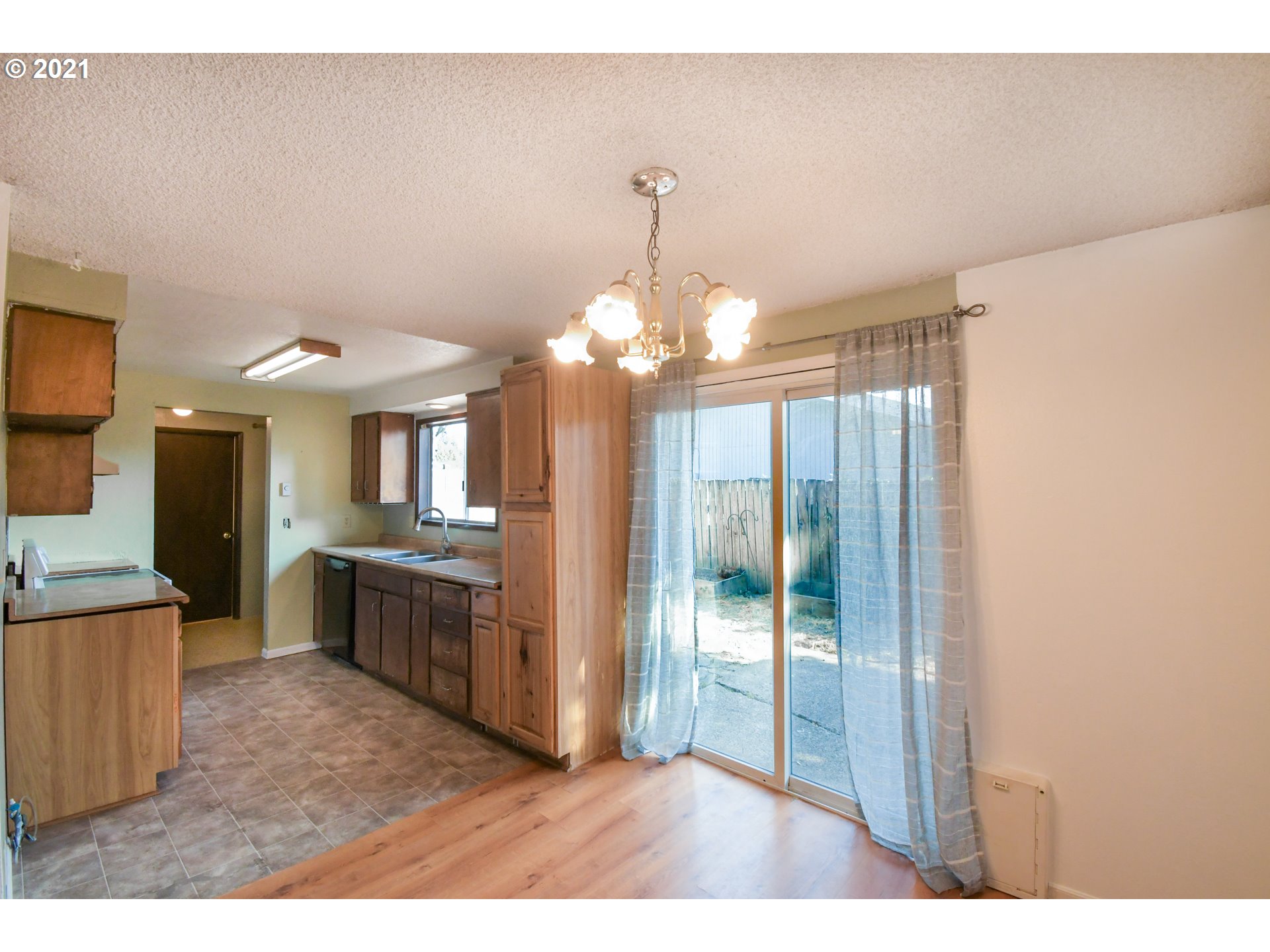 5231 G Street Springfield, OR 97478 - Photo 8 of 17 a open kitchen with granite countertop a refrigerator and a sink