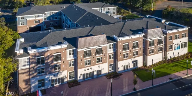 a view of a building with a yard