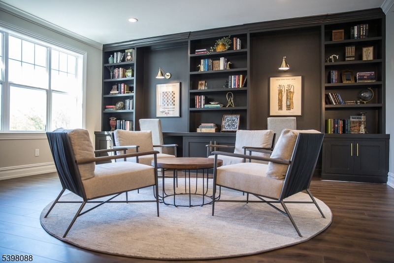 663 Springfield Avenue, Unit 53 Berkeley Heights, NJ 07922 - Photo 13 of 14 a living room with furniture and a book shelf