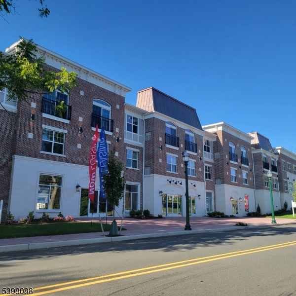 663 Springfield Avenue, Unit 53 Berkeley Heights, NJ 07922 - Photo 2 of 14 a building that has a tree on the side of it