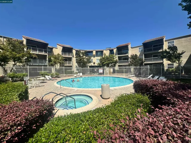 a view of a swimming pool with a patio