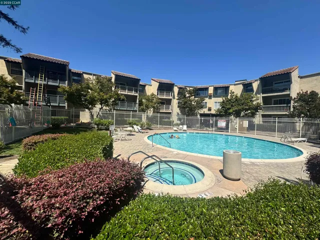 a view of a swimming pool with a patio