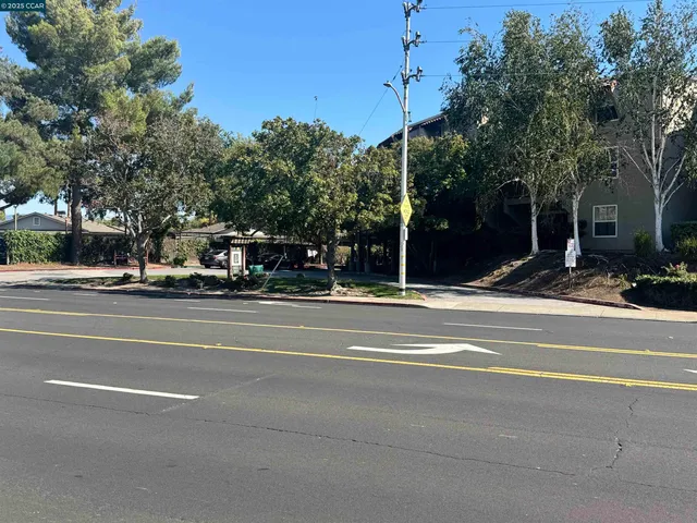 a view of street with parked cars