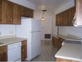 903 South Riverside Drive Indialantic, FL 32903 - Photo 4 of 8 a kitchen with stainless steel appliances granite countertop a refrigerator and a sink