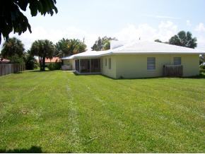 903 South Riverside Drive Indialantic, FL 32903 - Photo 8 of 8 a front view of a house with a garden