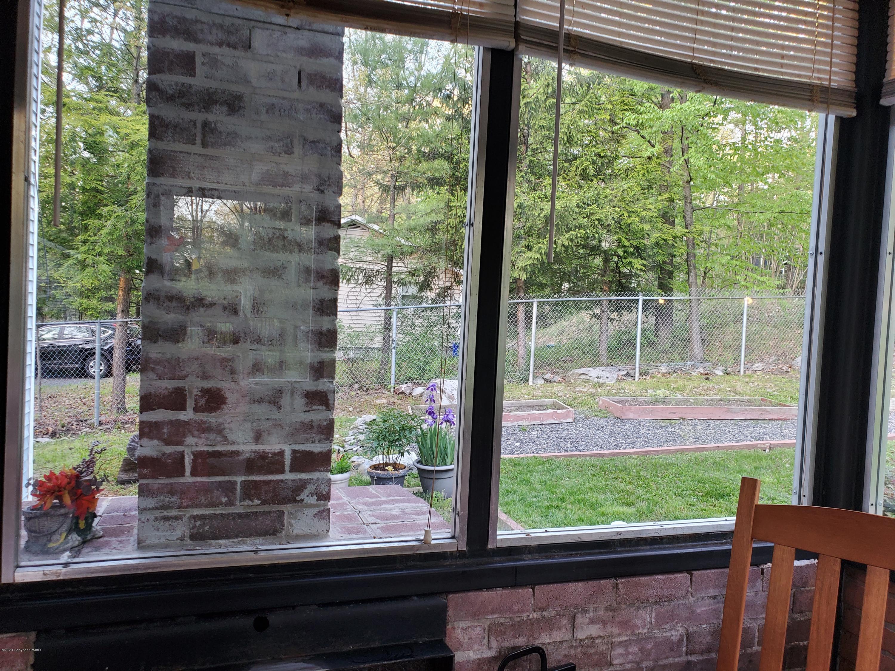 2124 Walnut Trail Bushkill, PA 18324 - Photo 26 of 37 Backyard view from sunroom
