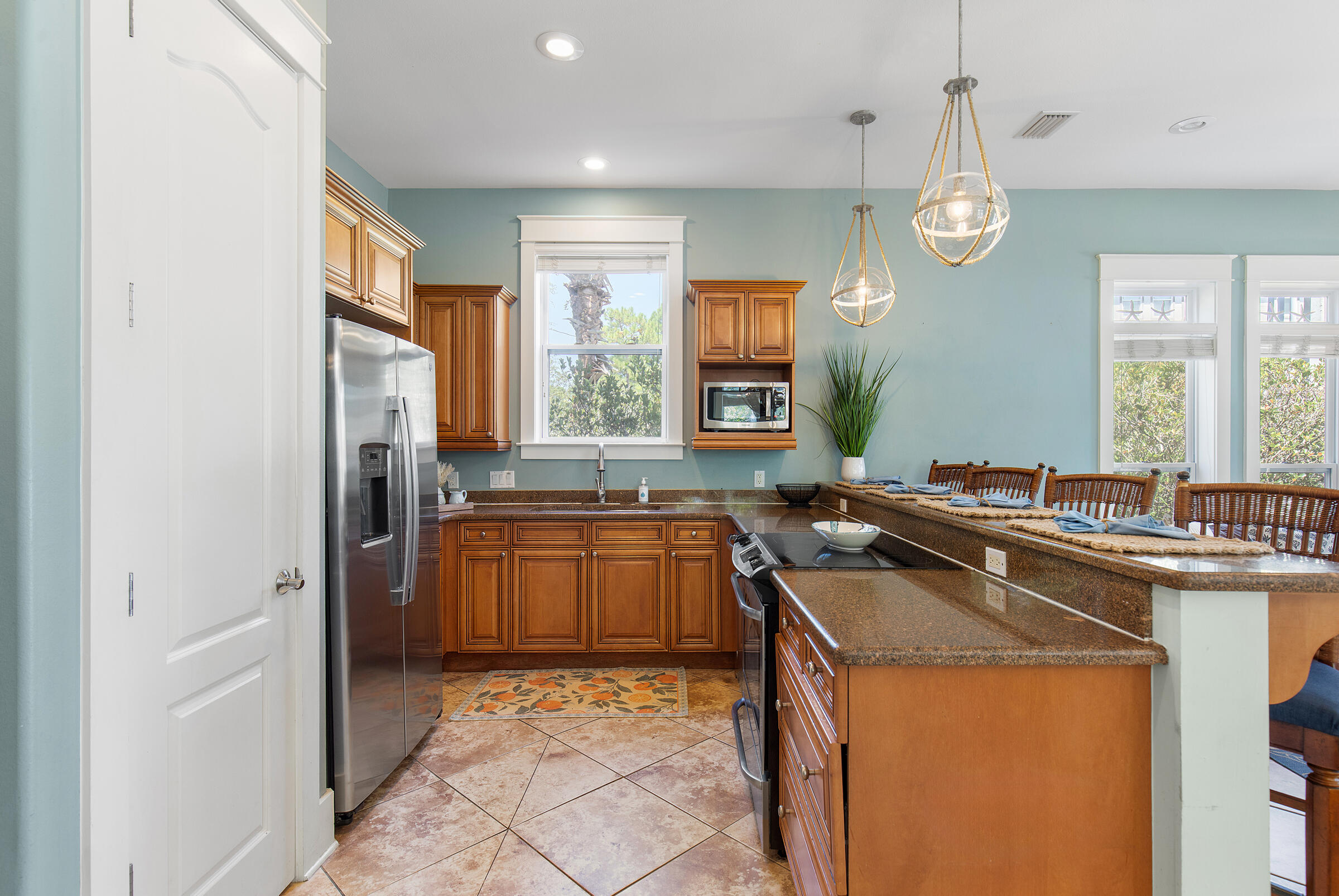 8 Dunes Estates Boulevard Santa Rosa Beach, FL 32459 - Photo 11 of 42 a kitchen with a sink a counter top space and stainless steel appliances