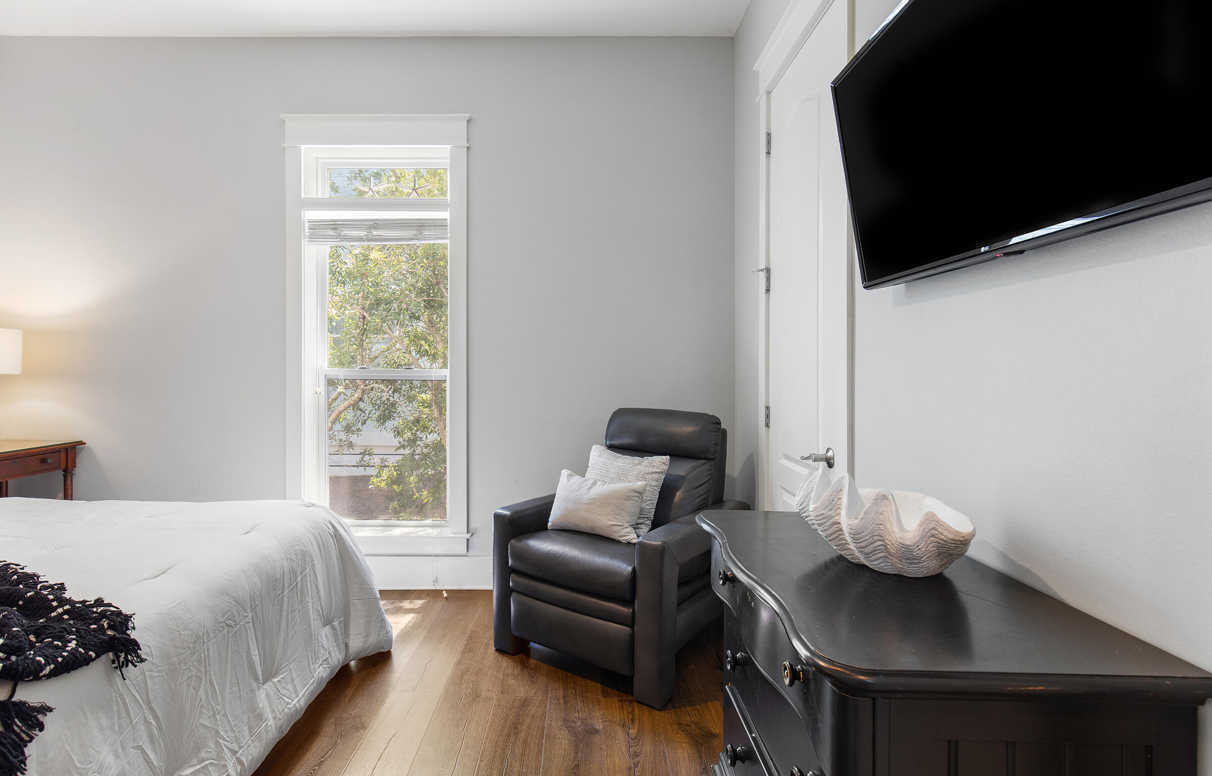 8 Dunes Estates Boulevard Santa Rosa Beach, FL 32459 - Photo 14 of 42 a bedroom with a bed and chair