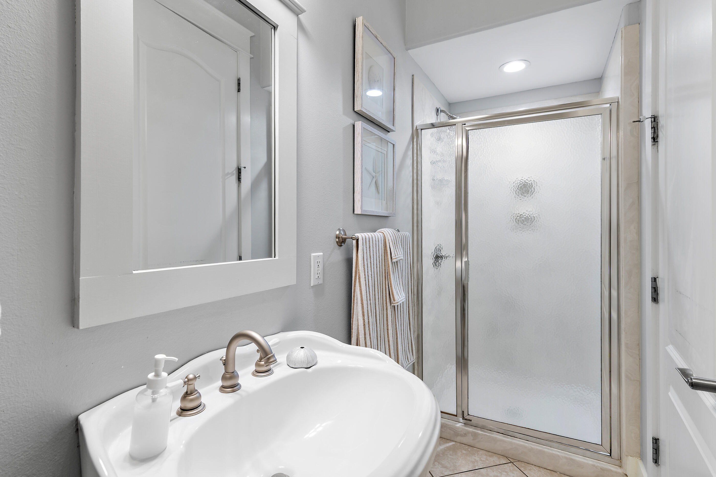 8 Dunes Estates Boulevard Santa Rosa Beach, FL 32459 - Photo 15 of 43 a bathroom with a shower sink and mirror