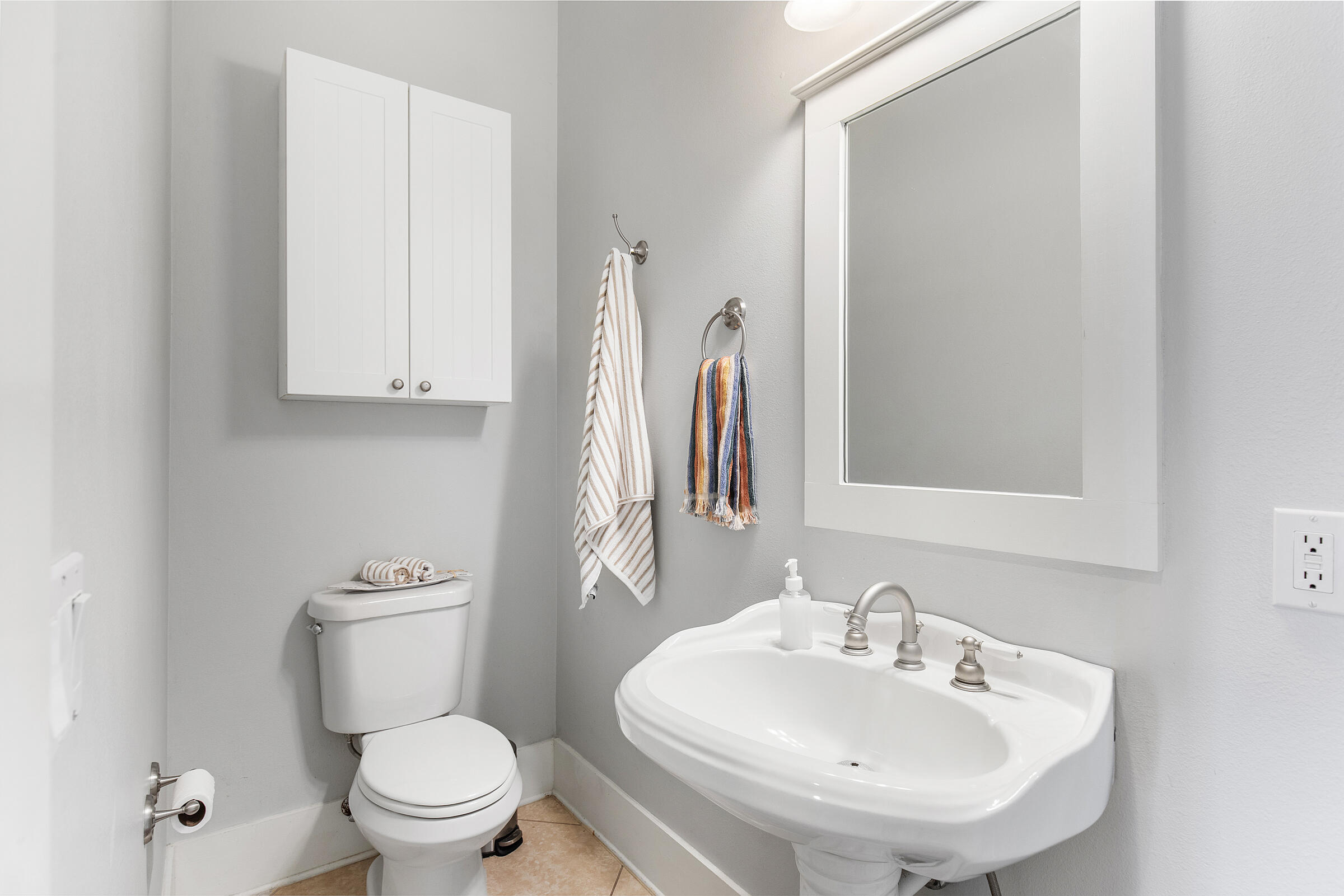 8 Dunes Estates Boulevard Santa Rosa Beach, FL 32459 - Photo 15 of 42 a bathroom with a sink a toilet and a mirror