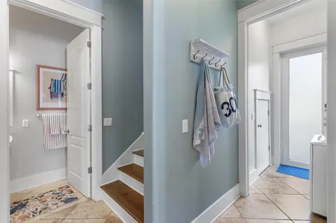 a view of an entryway with wooden floor