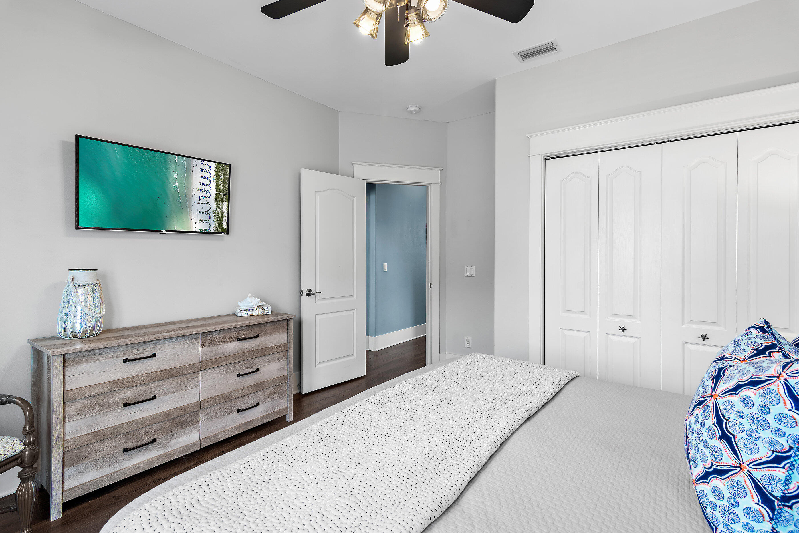 8 Dunes Estates Boulevard Santa Rosa Beach, FL 32459 - Photo 18 of 43 a bedroom with a bed and a chandelier
