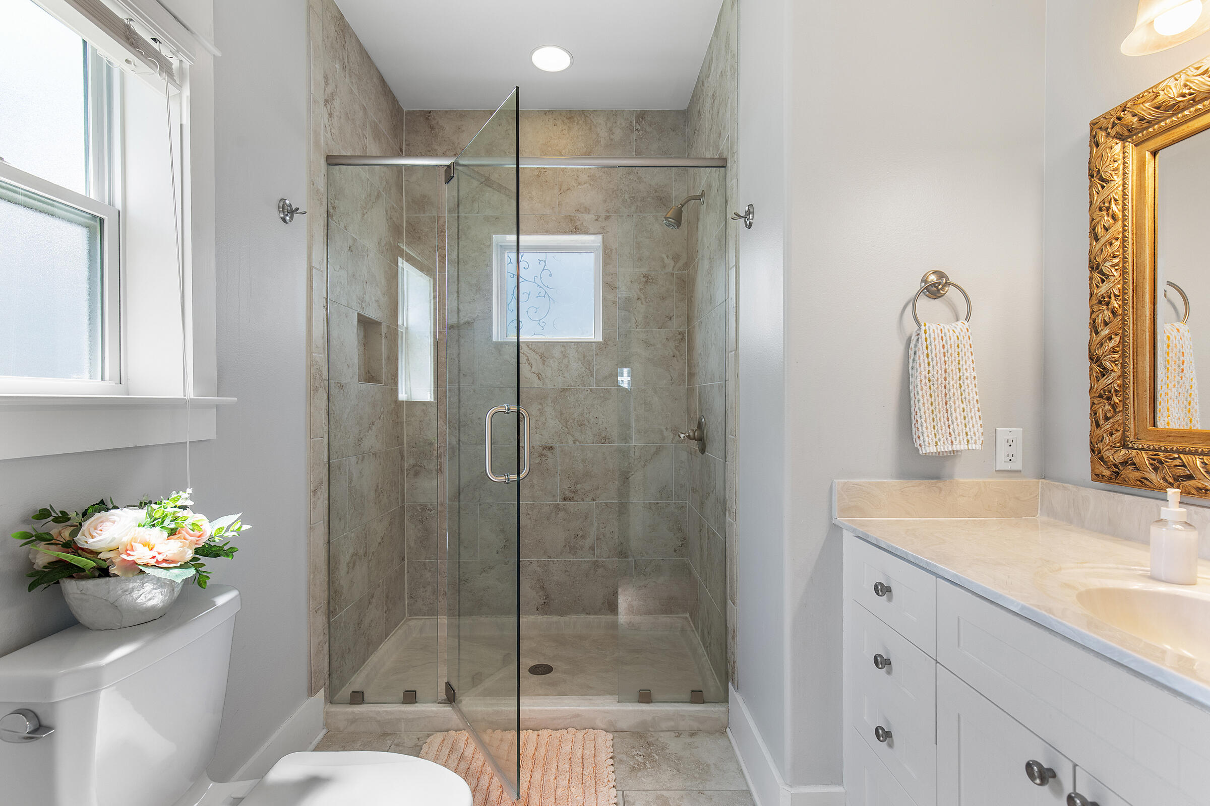 8 Dunes Estates Boulevard Santa Rosa Beach, FL 32459 - Photo 20 of 42 a bathroom with a shower sink vanity mirror and toilet
