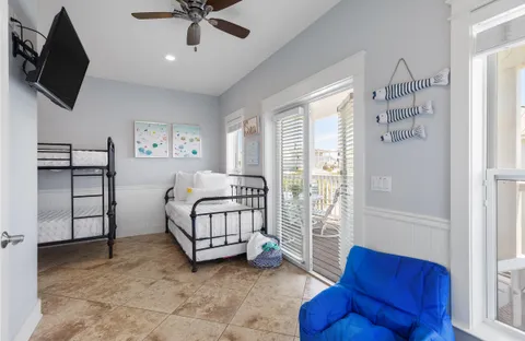 a bedroom with furniture and a flat screen tv