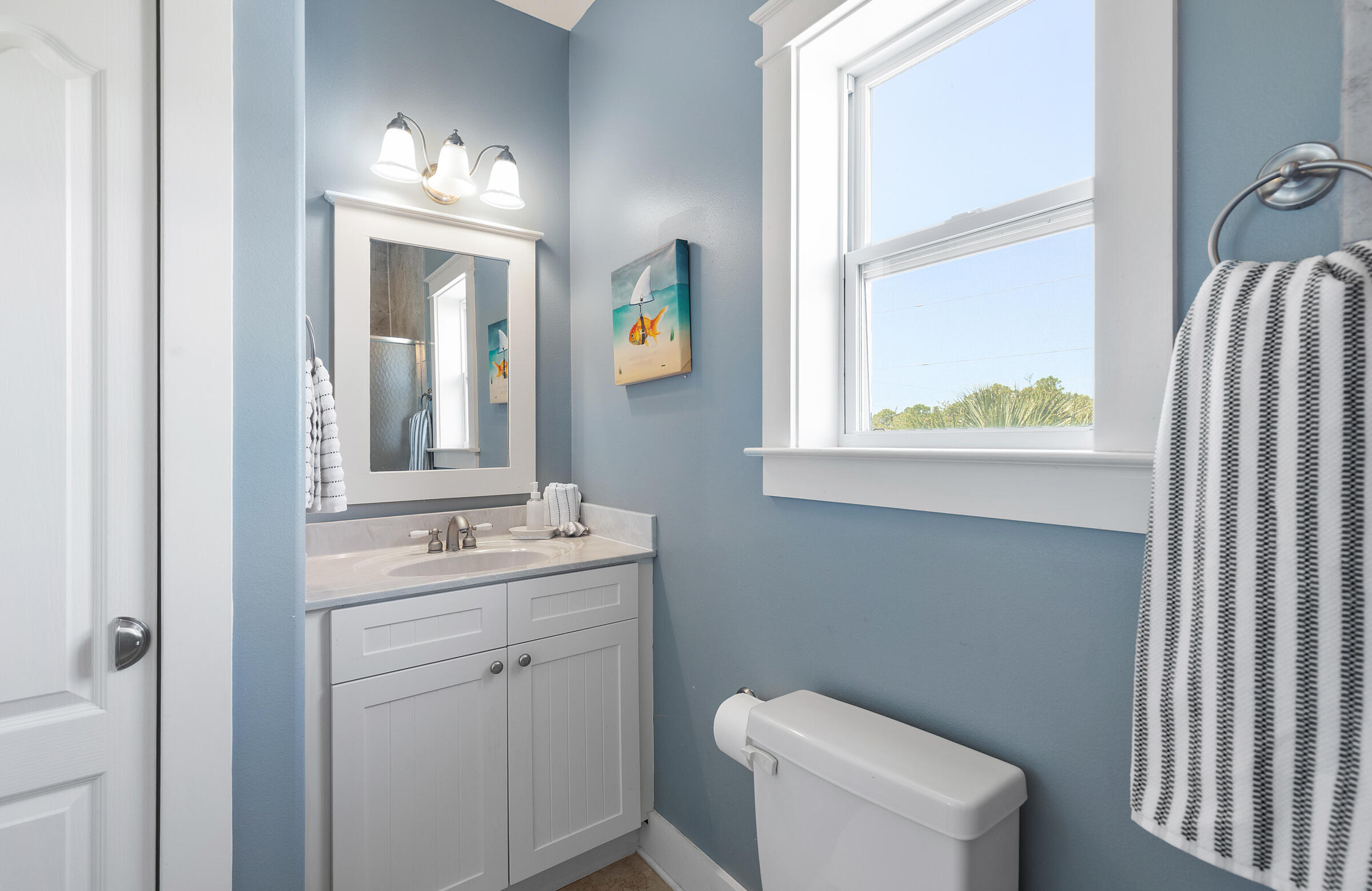8 Dunes Estates Boulevard Santa Rosa Beach, FL 32459 - Photo 29 of 42 a bathroom with a toilet sink and mirror