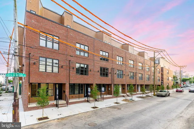a view of a brick house with a large window