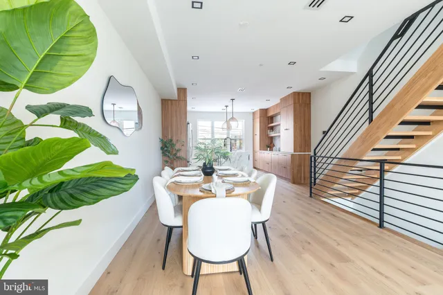 a view of entryway and gallery with wooden floor