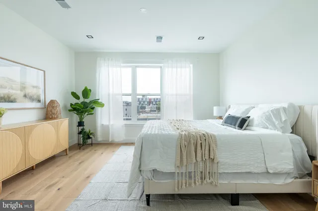 a large white building with a city view